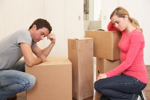 Employees moving office furniture during a Camden relocation